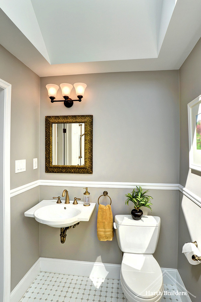 This is an example of a medium sized traditional bathroom in Philadelphia with a built-in shower, a two-piece toilet, grey tiles, porcelain tiles, grey walls, porcelain flooring and a wall-mounted sink.