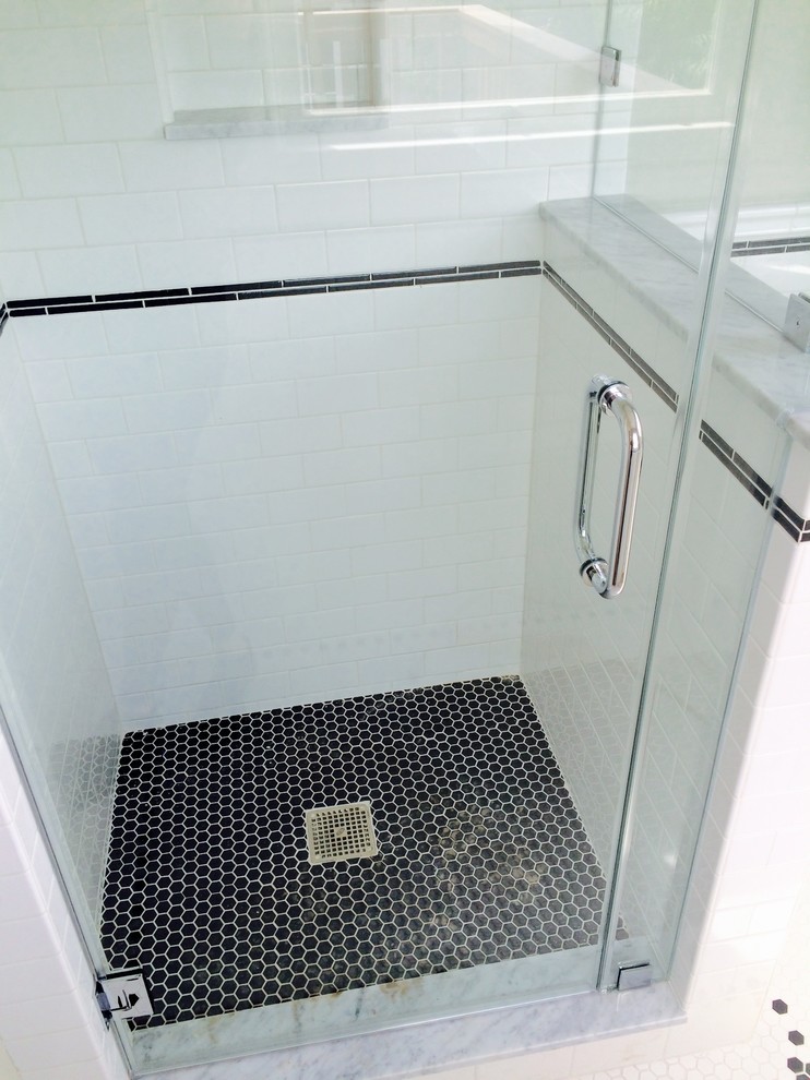 Small contemporary shower room bathroom in Los Angeles with flat-panel cabinets, white cabinets, a corner shower, black and white tiles, ceramic tiles, grey walls, ceramic flooring, a wall-mounted sink, tiled worktops, white floors and a hinged door.