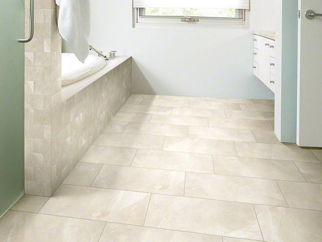 Cette photo montre une salle de bain tendance avec un carrelage blanc, des carreaux de porcelaine et un sol en carrelage de porcelaine.