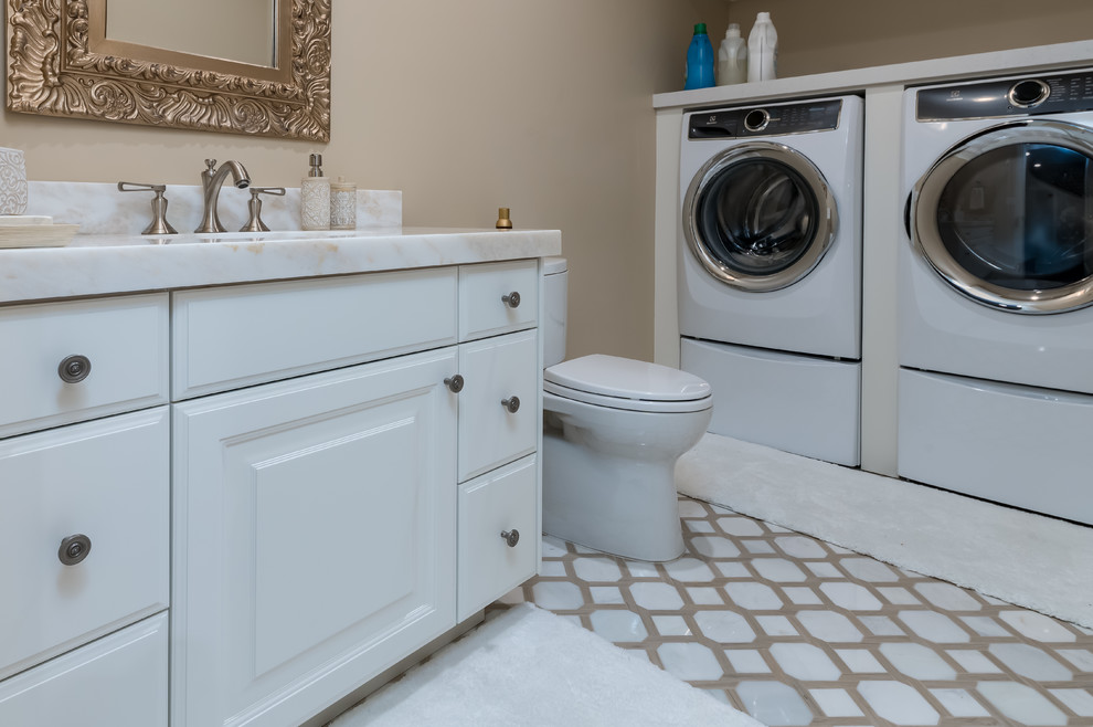 Design ideas for a medium sized classic family bathroom in Salt Lake City with raised-panel cabinets, white cabinets, a two-piece toilet, blue walls, marble flooring, a submerged sink, white floors, white worktops and engineered stone worktops.