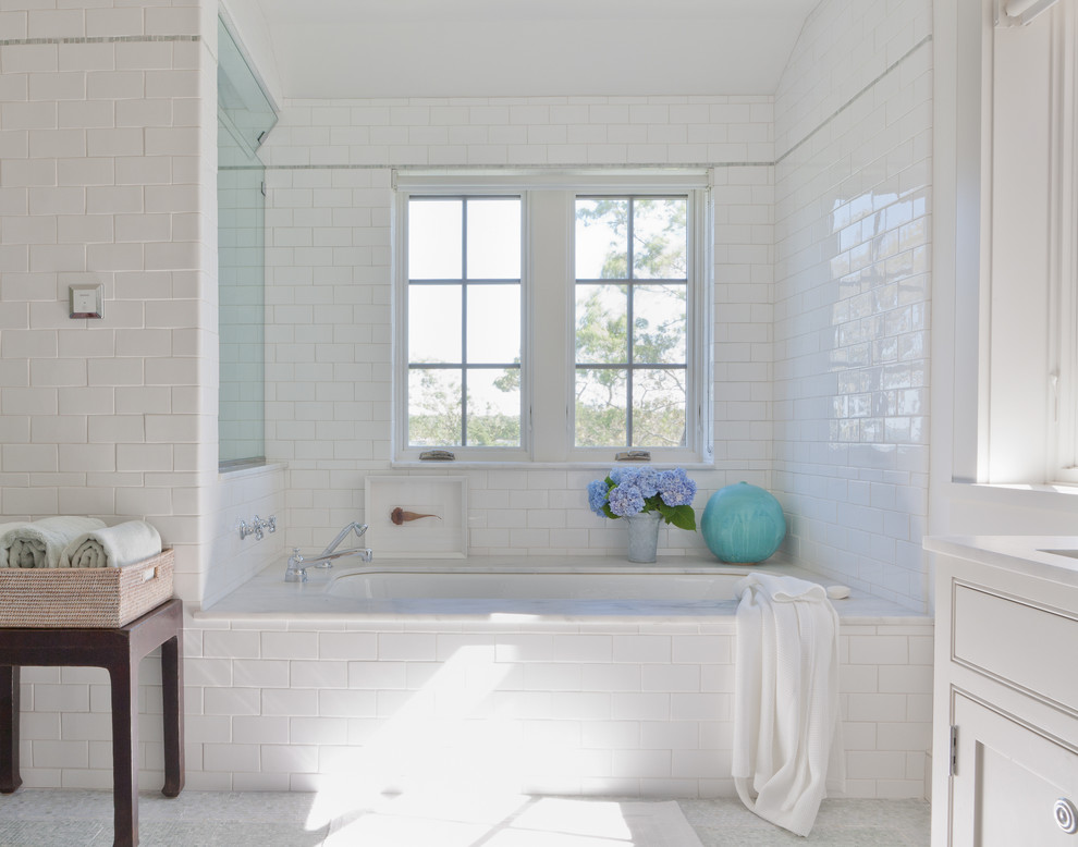 Beach style subway tile bathroom photo in New York with white countertops