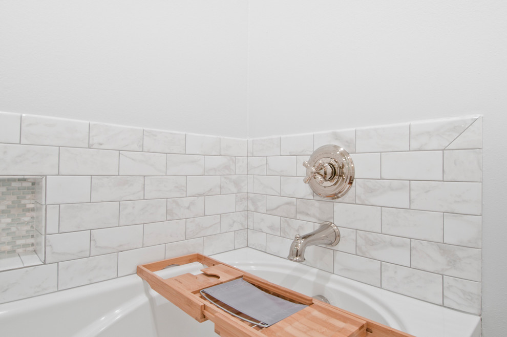 Mid-sized transitional master white tile and subway tile laminate floor and brown floor bathroom photo in Los Angeles with shaker cabinets, white cabinets, a two-piece toilet, white walls, an undermount sink, quartzite countertops and a hinged shower door