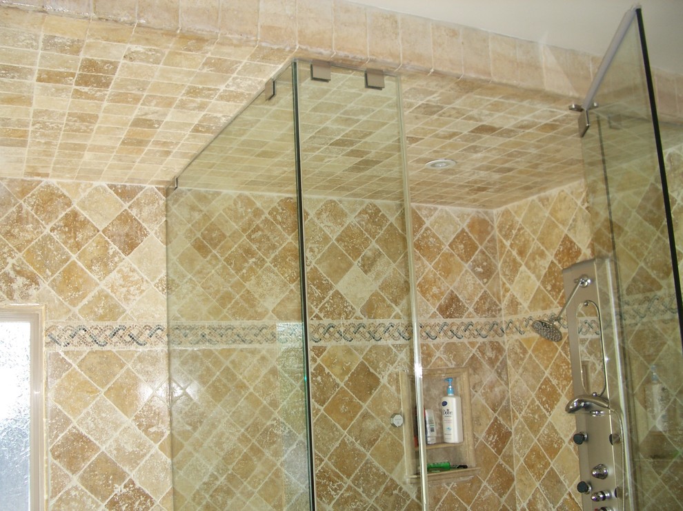 Design ideas for a medium sized mediterranean shower room bathroom in Los Angeles with freestanding cabinets, brown cabinets, a freestanding bath, an alcove shower, a one-piece toilet, beige tiles, travertine tiles, beige walls, travertine flooring, a built-in sink, engineered stone worktops, multi-coloured floors, a hinged door and brown worktops.