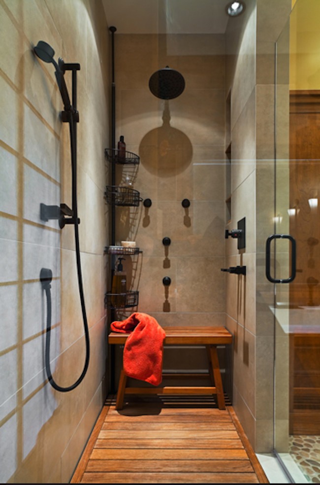 Diseño de cuarto de baño exótico de tamaño medio con puertas de armario de madera oscura, ducha empotrada, paredes grises y suelo de madera en tonos medios