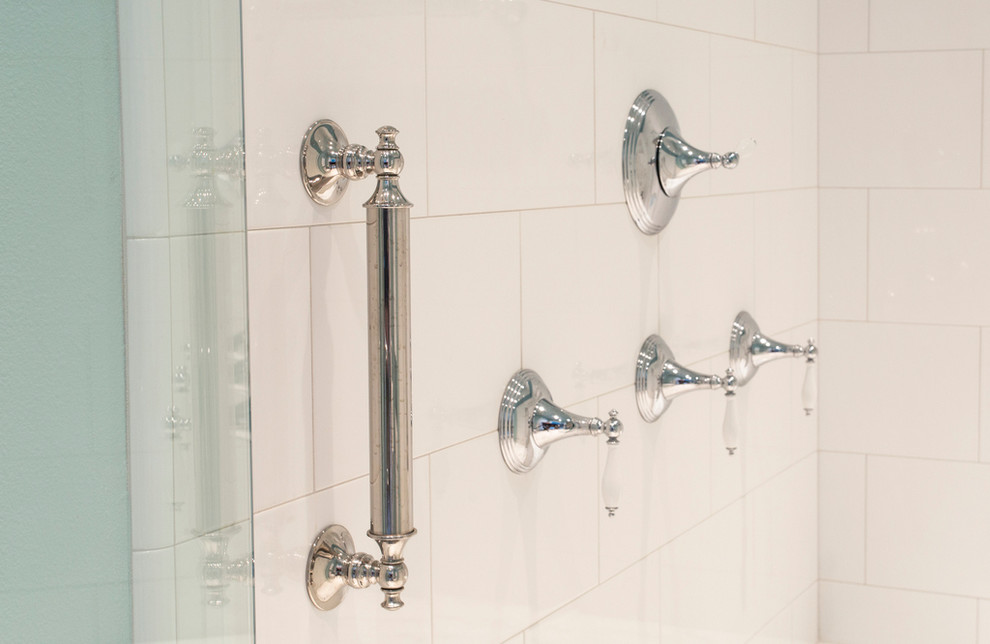 Mid-sized elegant master white tile and ceramic tile marble floor walk-in shower photo in Portland with a vessel sink, recessed-panel cabinets, dark wood cabinets, marble countertops, an undermount tub, a two-piece toilet and blue walls