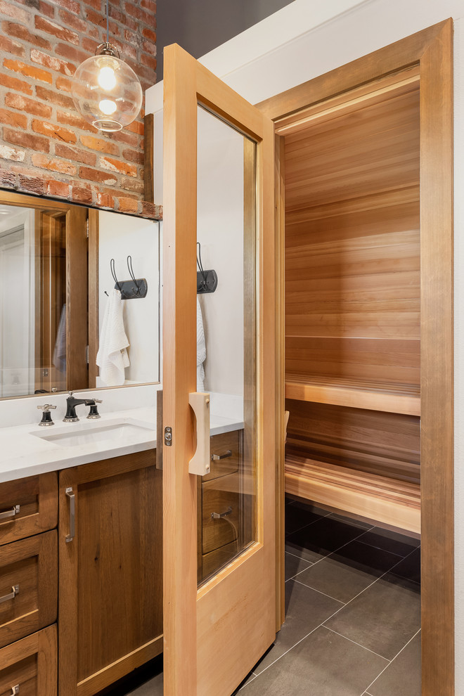 Inspiration for a medium sized farmhouse sauna bathroom in Portland with shaker cabinets, medium wood cabinets, a corner shower, marble tiles, white walls, slate flooring, black floors, an open shower and white worktops.
