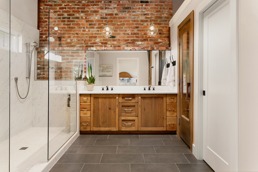 Mid-sized country master marble tile slate floor and black floor bathroom photo in Portland with shaker cabinets, medium tone wood cabinets, white walls and white countertops