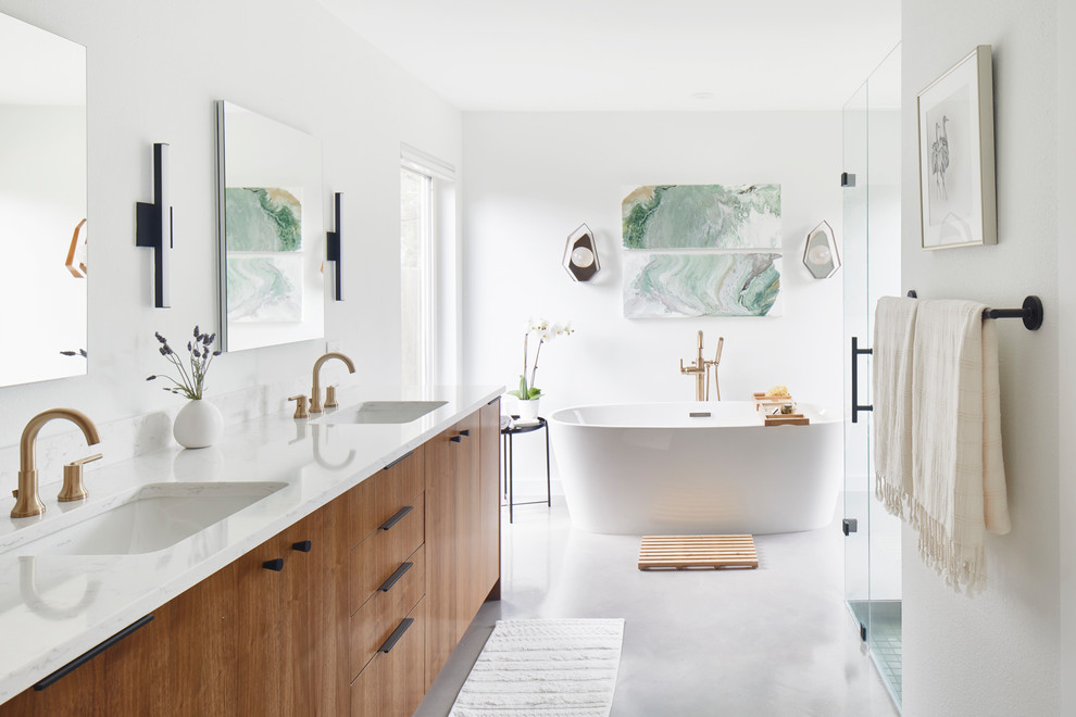 Inspiration for a large contemporary master white tile and ceramic tile white floor and concrete floor bathroom remodel in Austin with flat-panel cabinets, medium tone wood cabinets, white walls, an undermount sink, a hinged shower door, white countertops, a two-piece toilet and quartz countertops