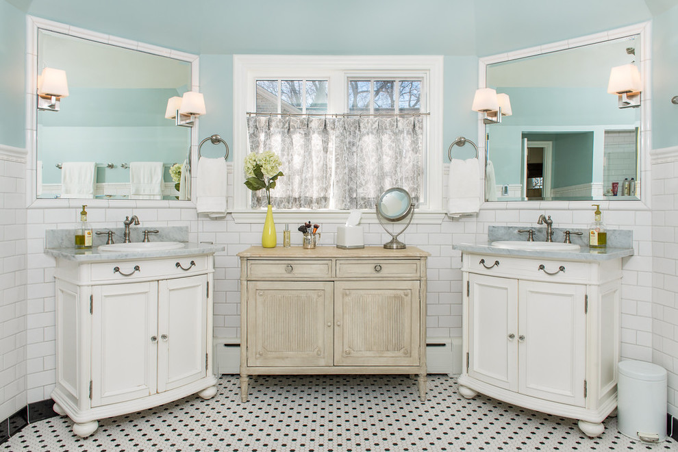 Inspiration for a traditional bathroom in Milwaukee with white tiles, metro tiles, blue walls, a built-in sink and multi-coloured floors.
