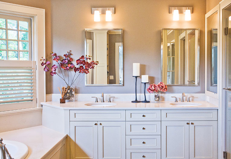 Inspiration for a mid-sized transitional master bathroom remodel in New York with a drop-in sink, beaded inset cabinets, white cabinets, granite countertops and beige walls