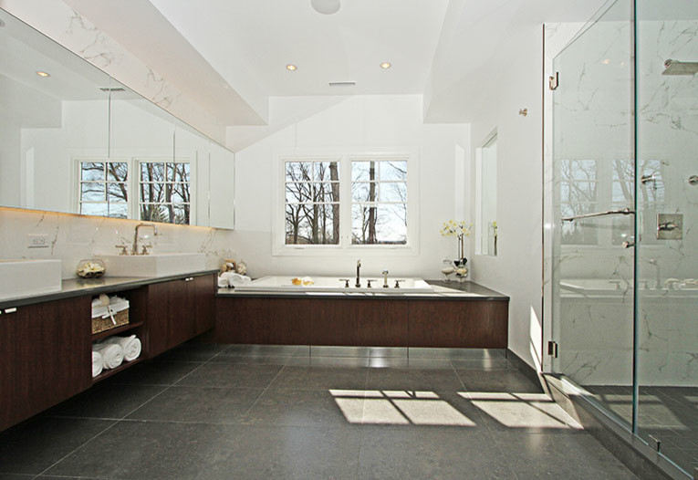 Example of a trendy master ceramic tile and white tile ceramic tile bathroom design in New York with a vessel sink, flat-panel cabinets, dark wood cabinets and white walls