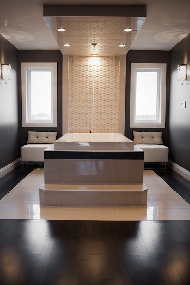 На фото: ванная комната в современном стиле с накладной ванной, бежевой плиткой и черными стенами с
