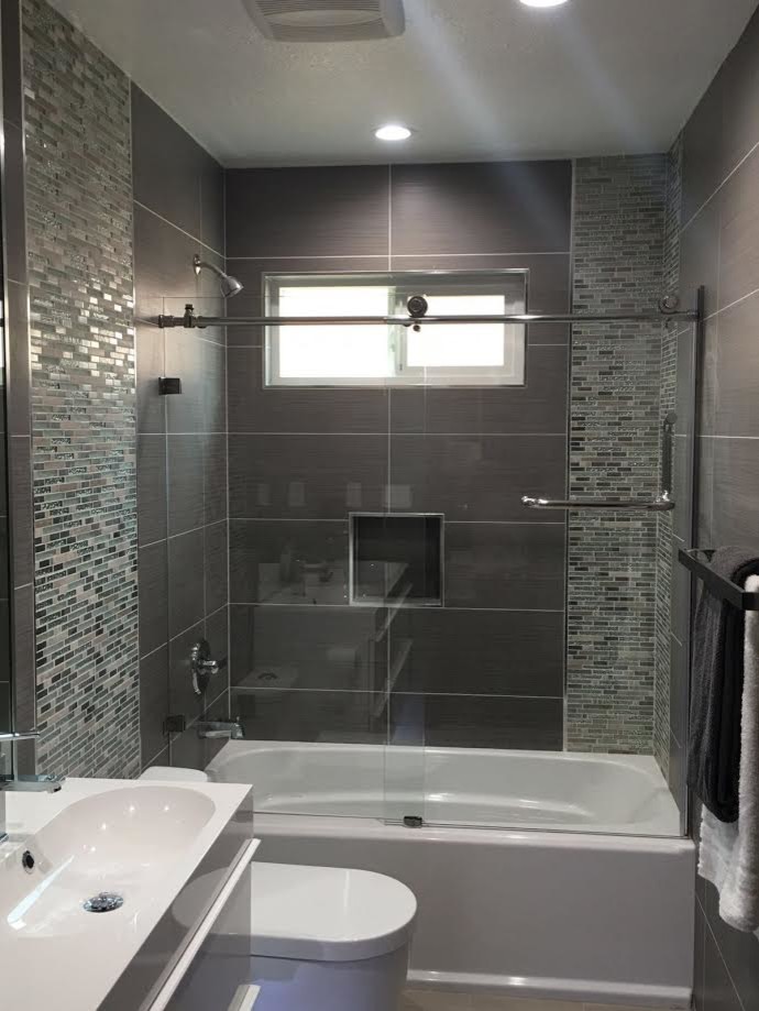 Inspiration for a medium sized traditional shower room bathroom in San Francisco with grey cabinets, an alcove bath, a shower/bath combination, a one-piece toilet, grey tiles, ceramic tiles, grey walls and cement flooring.