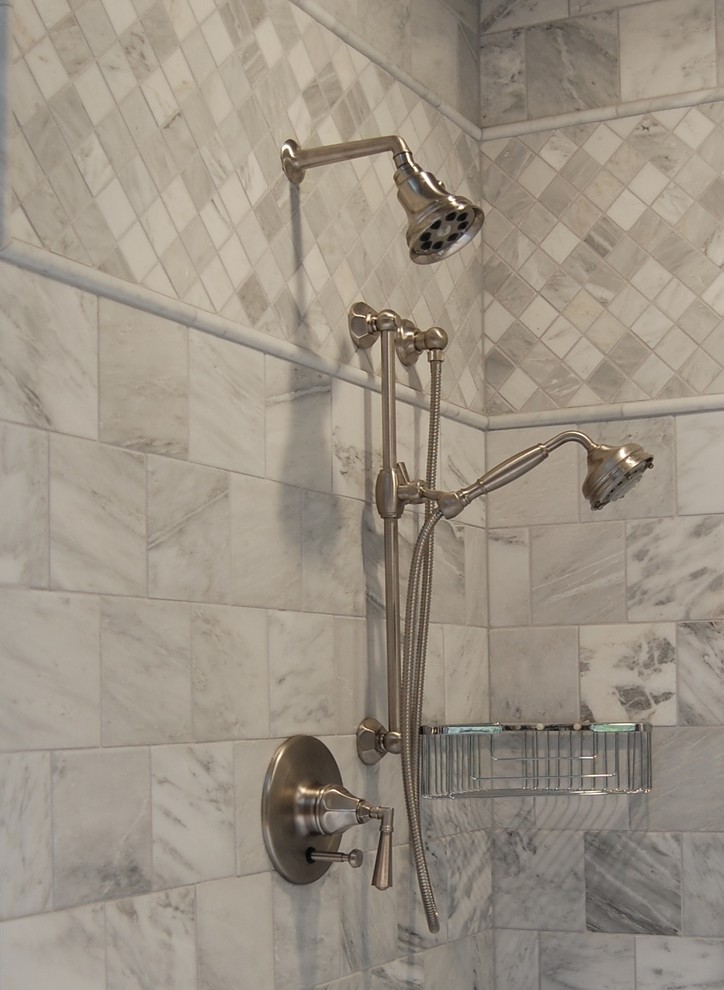 Example of a large classic master gray tile and stone tile marble floor bathroom design in Portland with an undermount sink, shaker cabinets, medium tone wood cabinets, marble countertops, a wall-mount toilet, gray walls, a hinged shower door and gray countertops