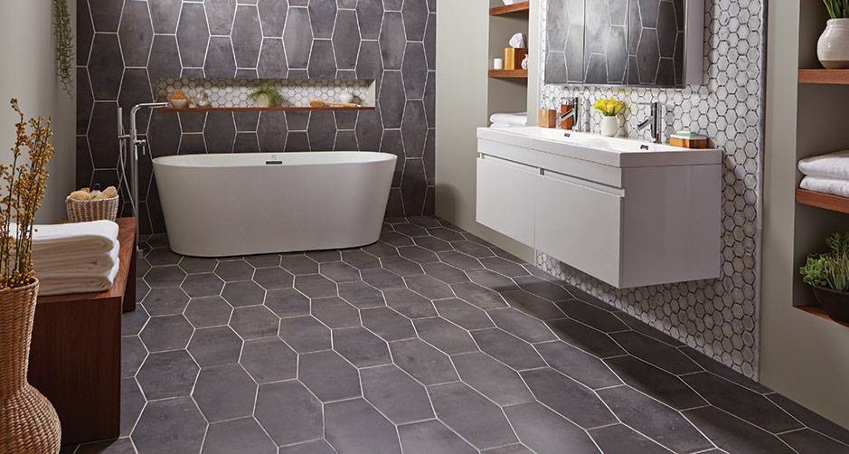 Design ideas for a medium sized traditional ensuite bathroom in DC Metro with grey tiles, flat-panel cabinets, white cabinets, porcelain tiles, beige walls, porcelain flooring, an integrated sink and grey floors.