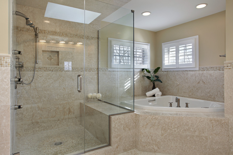 Inspiration for a mid-sized timeless master beige tile and stone tile travertine floor and beige floor bathroom remodel in Atlanta with raised-panel cabinets, brown cabinets, a one-piece toilet, beige walls, a drop-in sink, granite countertops, a hinged shower door and black countertops