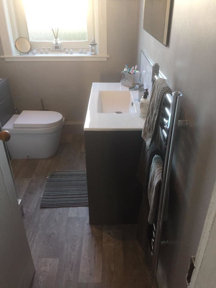Inspiration for a small modern shower room bathroom in Other with dark wood cabinets, a two-piece toilet, a built-in sink, beige floors and a hinged door.
