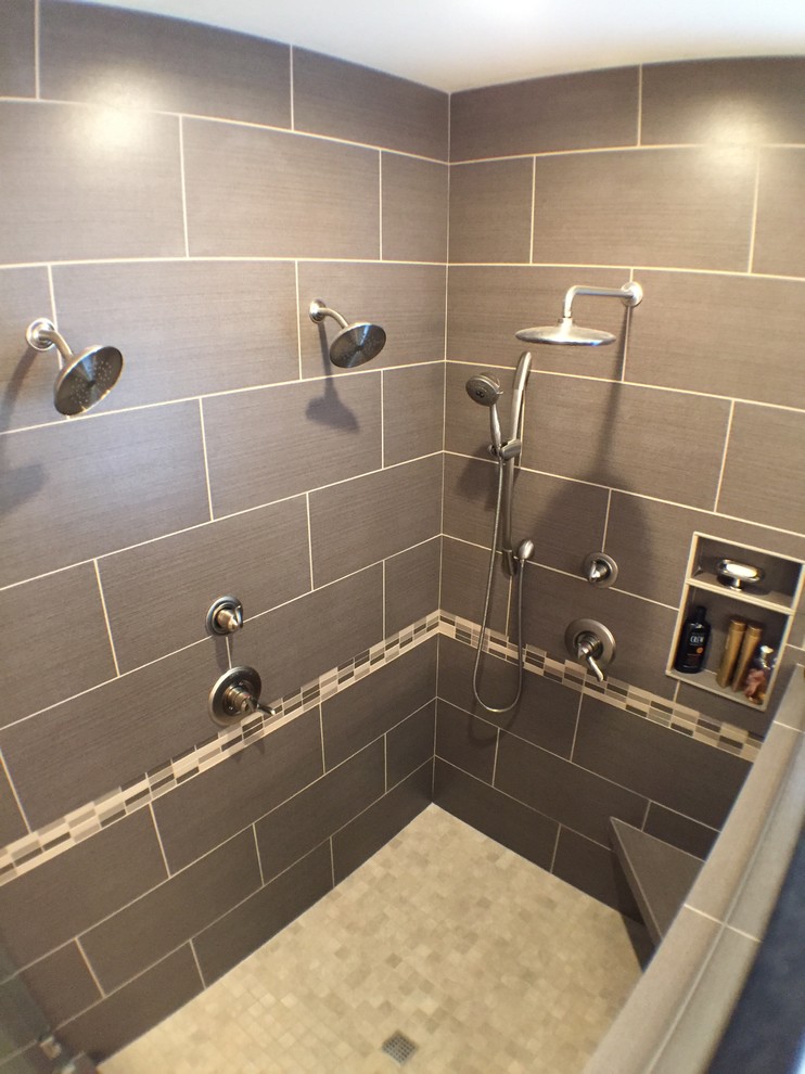 Large contemporary ensuite bathroom in Portland with a built-in sink, freestanding cabinets, laminate worktops, an alcove bath, a corner shower, black tiles, porcelain tiles, beige walls and ceramic flooring.
