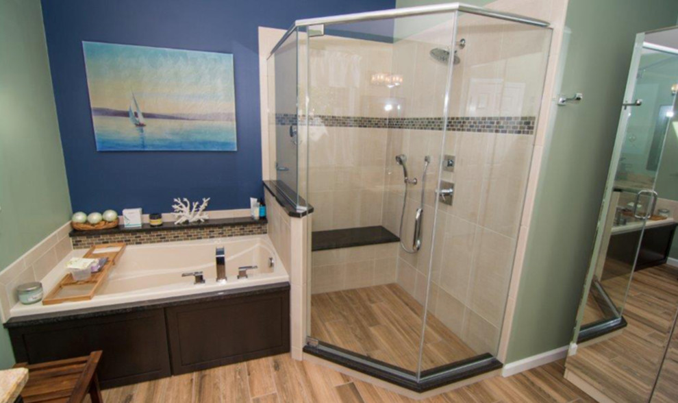 Example of a small beach style 3/4 beige tile and ceramic tile ceramic tile and beige floor bathroom design in Philadelphia with shaker cabinets, dark wood cabinets, a two-piece toilet, blue walls, an undermount sink, granite countertops and a hinged shower door