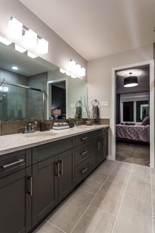 Walk-in shower - mid-sized transitional master gray tile and glass tile porcelain tile walk-in shower idea in Calgary with shaker cabinets, gray cabinets, a one-piece toilet, gray walls, an undermount sink and granite countertops