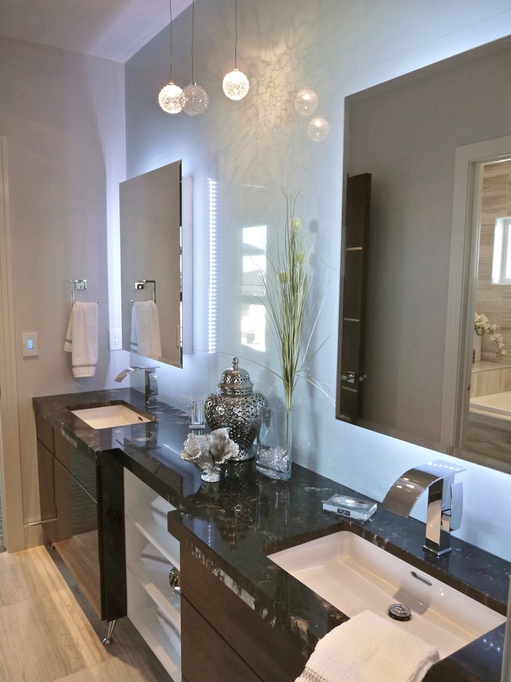 Mid-sized minimalist porcelain tile bathroom photo in Other with an undermount sink, flat-panel cabinets, black cabinets, quartz countertops and gray walls