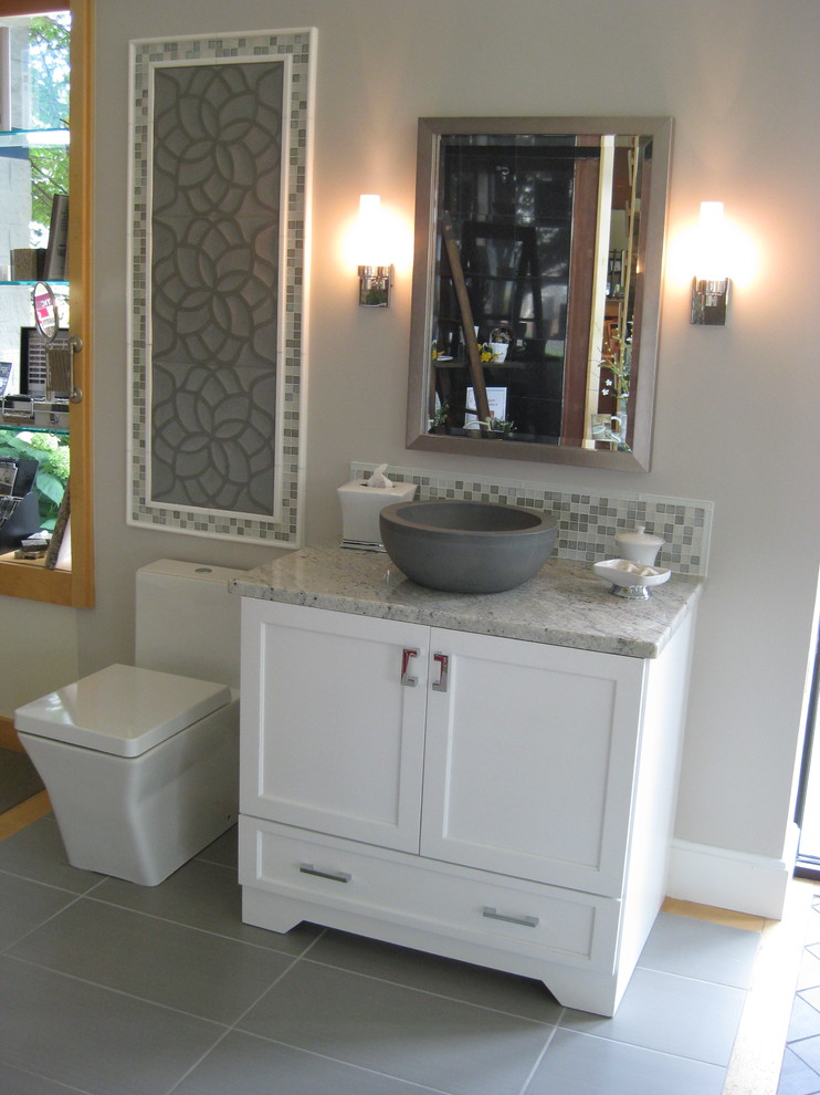 Example of a mid-sized trendy green tile and mosaic tile porcelain tile and gray floor bathroom design in Milwaukee with shaker cabinets, white cabinets, a two-piece toilet, gray walls, a vessel sink and quartzite countertops
