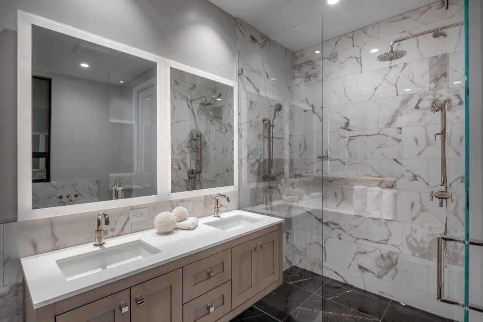 Example of a mid-sized transitional master white tile and porcelain tile marble floor, black floor and double-sink walk-in shower design in San Francisco with shaker cabinets, light wood cabinets, gray walls, an undermount sink, quartz countertops, a hinged shower door, white countertops, a floating vanity and a niche