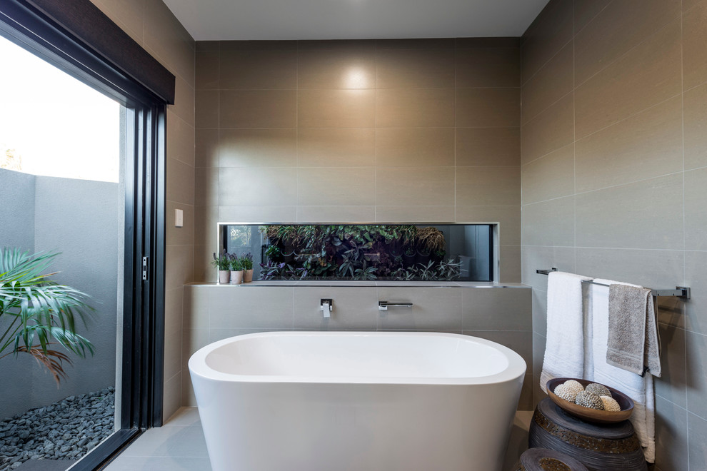 Inspiration for a medium sized world-inspired ensuite bathroom in Brisbane with flat-panel cabinets, brown cabinets, a freestanding bath, a corner shower, a one-piece toilet, beige tiles, cement tiles, beige walls, ceramic flooring, a vessel sink and engineered stone worktops.