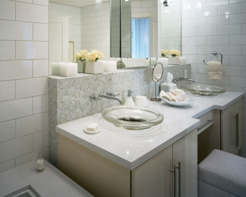 This is an example of a medium sized traditional shower room bathroom in Other with flat-panel cabinets, white cabinets, a corner bath, a walk-in shower, a one-piece toilet, grey tiles, multi-coloured tiles, white tiles, stone slabs, white walls, ceramic flooring, a pedestal sink and soapstone worktops.