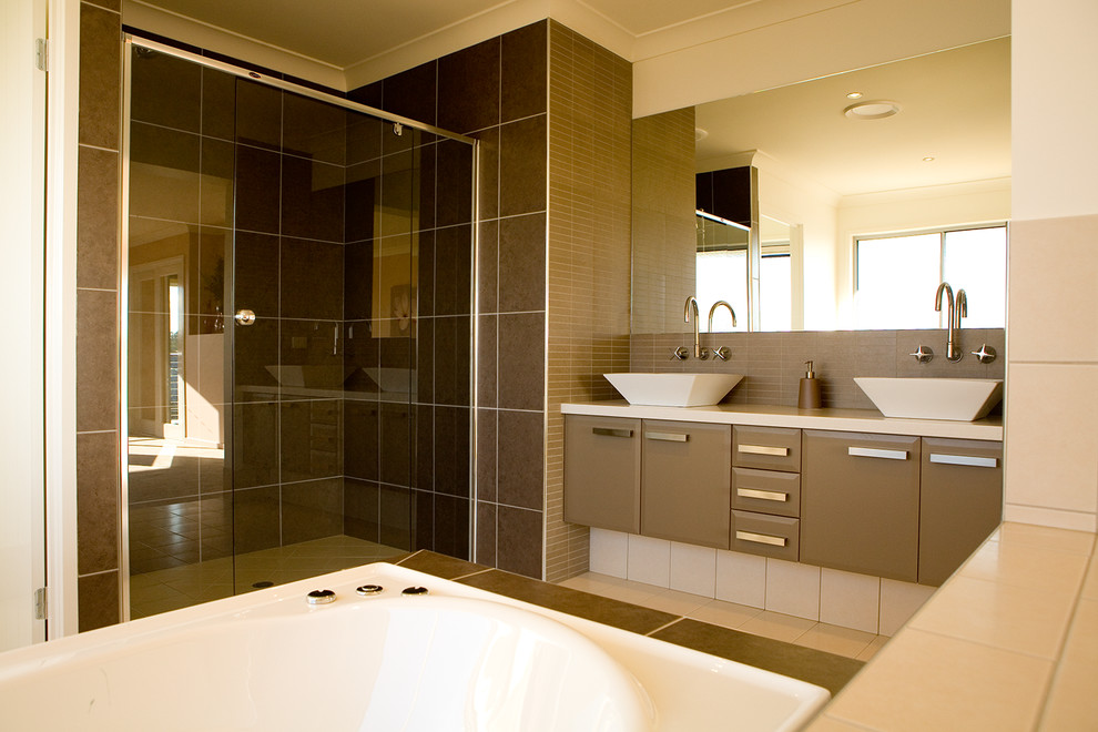Inspiration for a medium sized contemporary bathroom in Brisbane with a vessel sink, flat-panel cabinets, brown cabinets, laminate worktops, a built-in bath, a built-in shower, a one-piece toilet, brown tiles, ceramic tiles, beige walls and ceramic flooring.