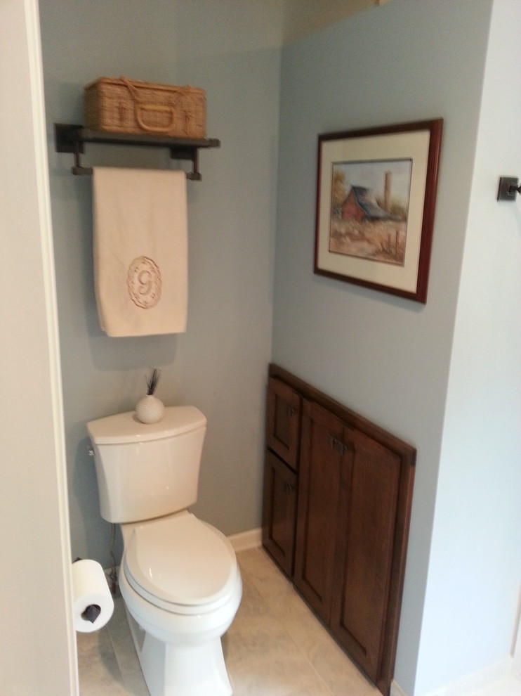Large elegant green tile and cement tile ceramic tile powder room photo in Milwaukee with an undermount sink, furniture-like cabinets, medium tone wood cabinets, quartz countertops, a two-piece toilet and blue walls