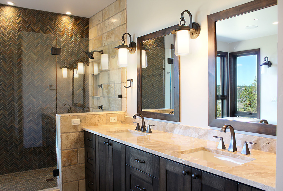 Inspiration for a mid-sized contemporary master brown tile and stone tile slate floor bathroom remodel in Albuquerque with shaker cabinets, brown cabinets, beige walls, an undermount sink, granite countertops, a hinged shower door and beige countertops