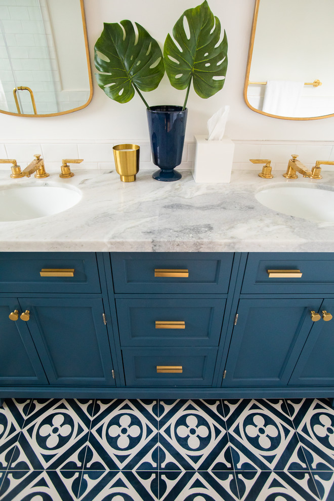 Mid-sized master white tile and subway tile ceramic tile and blue floor bathroom photo in Los Angeles with shaker cabinets, blue cabinets, a one-piece toilet, white walls, an undermount sink, marble countertops, a hinged shower door and gray countertops