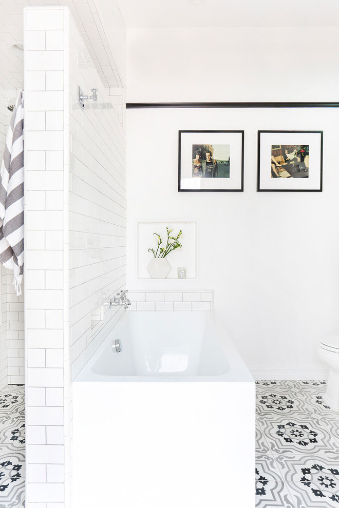 Inspiration for a medium sized traditional ensuite bathroom in Los Angeles with recessed-panel cabinets, white cabinets, a walk-in shower, grey tiles, cement tiles, white walls, a submerged sink and marble worktops.
