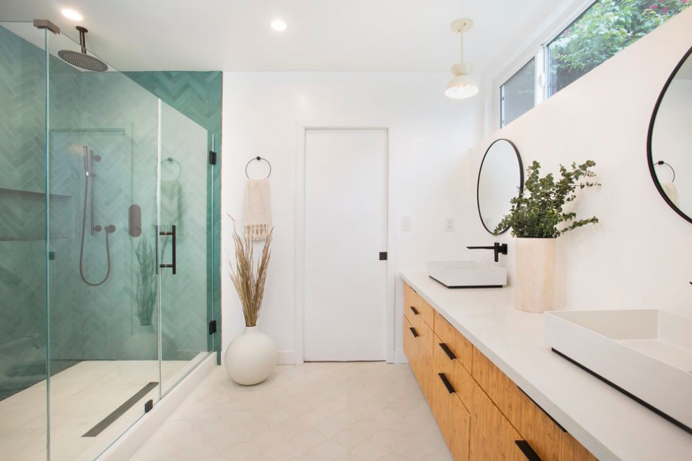 Inspiration for a mid-sized scandinavian master blue tile and ceramic tile ceramic tile and white floor corner shower remodel in Los Angeles with white walls, a hinged shower door, flat-panel cabinets, medium tone wood cabinets, a vessel sink, quartz countertops and gray countertops