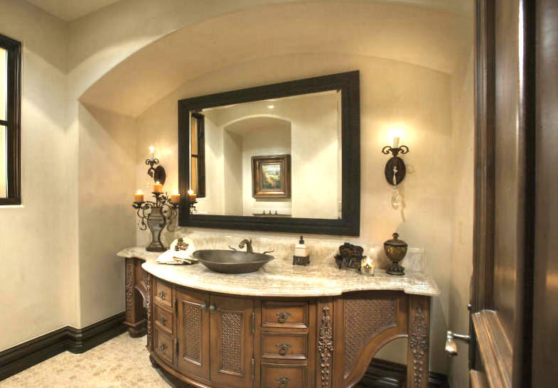 Huge tuscan master multicolored tile and marble tile mosaic tile floor and beige floor bathroom photo in Phoenix with furniture-like cabinets, brown cabinets, a one-piece toilet, beige walls, a vessel sink, marble countertops, a hinged shower door and multicolored countertops