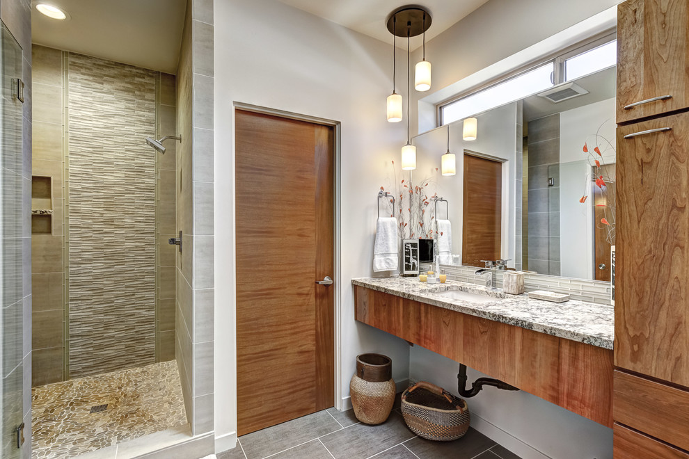 Inspiration for a mid-sized mid-century modern master porcelain tile and gray floor alcove shower remodel in Portland with open cabinets, medium tone wood cabinets, gray walls, an undermount sink, granite countertops, a hinged shower door and multicolored countertops