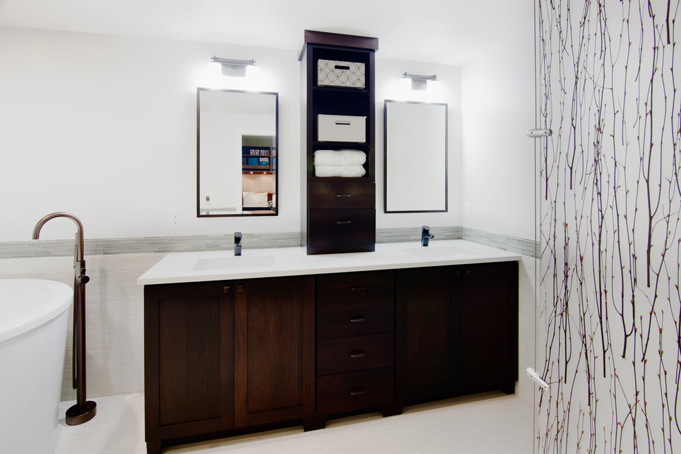 Photo of a medium sized modern ensuite bathroom in Seattle with shaker cabinets, dark wood cabinets, a japanese bath, a corner shower, a one-piece toilet, white tiles, porcelain tiles, white walls, porcelain flooring, a submerged sink and engineered stone worktops.