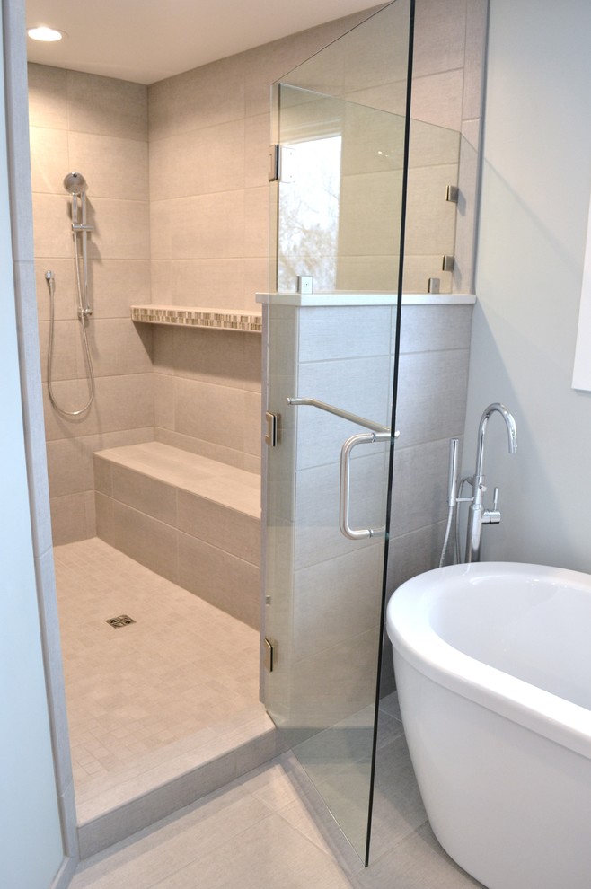 Design ideas for a large contemporary ensuite bathroom in Other with flat-panel cabinets, dark wood cabinets, a freestanding bath, a double shower, a two-piece toilet, grey tiles, porcelain tiles, grey walls, porcelain flooring, a submerged sink and engineered stone worktops.