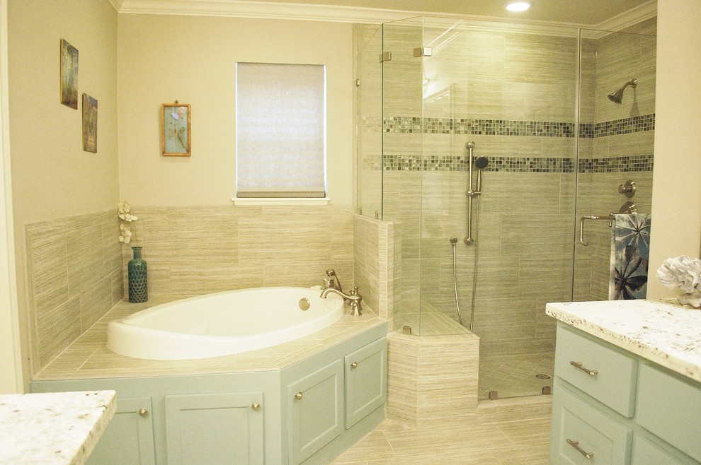 Inspiration for a medium sized traditional ensuite bathroom in Houston with a submerged sink, shaker cabinets, blue cabinets, granite worktops, a built-in bath, an alcove shower, a two-piece toilet, grey tiles, ceramic tiles, grey walls and ceramic flooring.