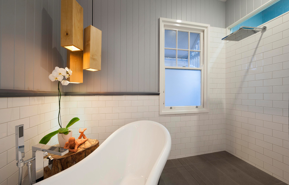 Inspiration for a large modern grey and white bathroom in Brisbane with a freestanding bath, white tiles, metro tiles, white walls, concrete flooring, grey floors, an open shower, panelled walls and tongue and groove walls.
