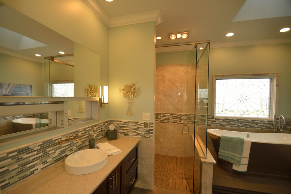 Huge transitional master beige tile and ceramic tile bathroom photo in Louisville with recessed-panel cabinets, dark wood cabinets, a wall-mount toilet, beige walls, a vessel sink and granite countertops