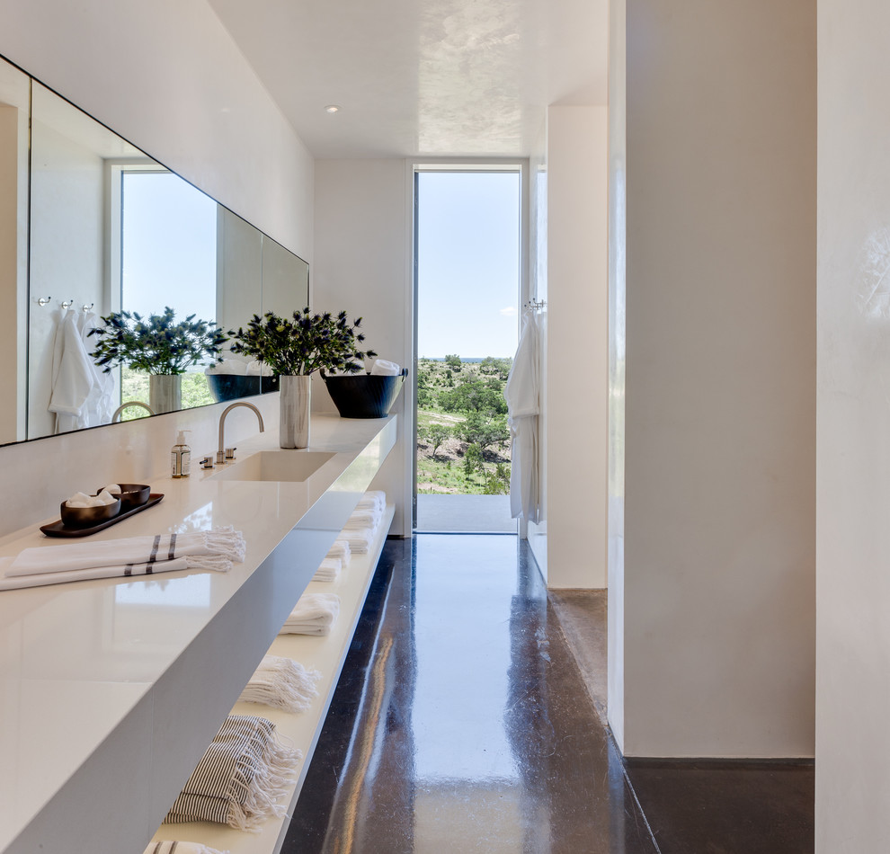 Small contemporary bathroom in Austin with an integrated sink, quartz worktops, a walk-in shower, white walls, concrete flooring, open cabinets and white cabinets.