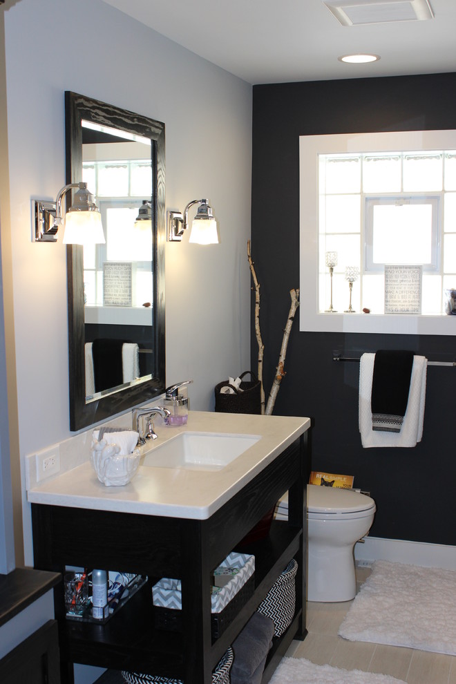 Example of a trendy white tile and porcelain tile bathroom design in Chicago with open cabinets, black cabinets and limestone countertops