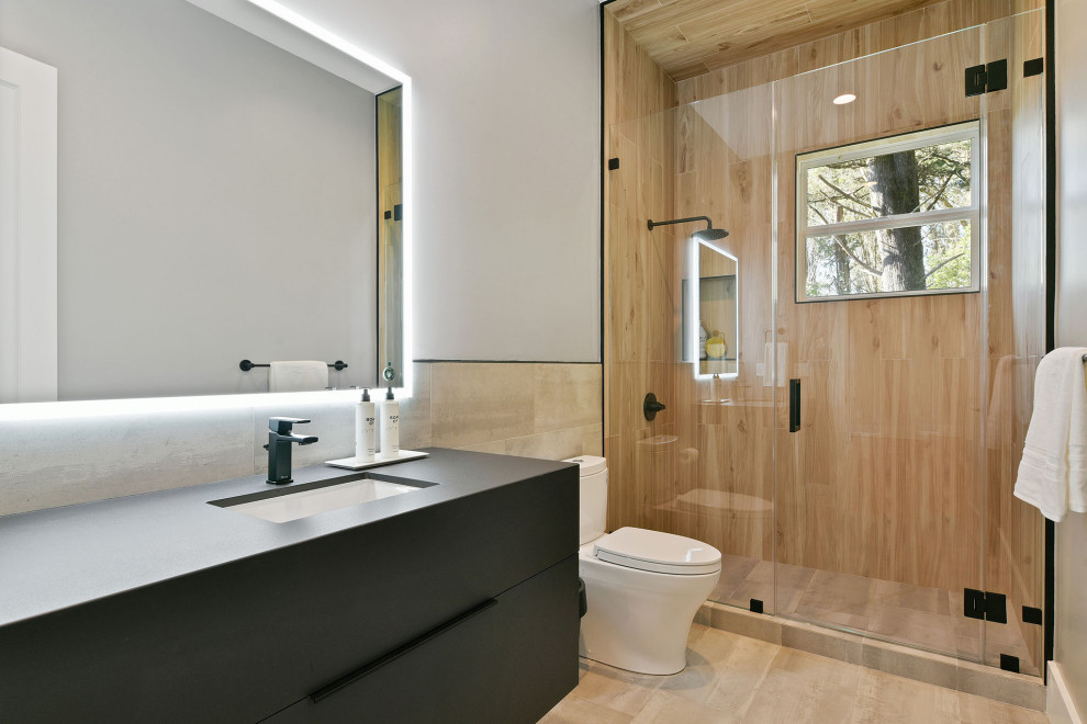 Design ideas for a medium sized contemporary shower room bathroom in San Francisco with black cabinets, an alcove shower, a submerged sink, solid surface worktops, a hinged door, black worktops, flat-panel cabinets, a two-piece toilet, brown tiles, wood-effect tiles, white walls, beige floors, a single sink and a floating vanity unit.