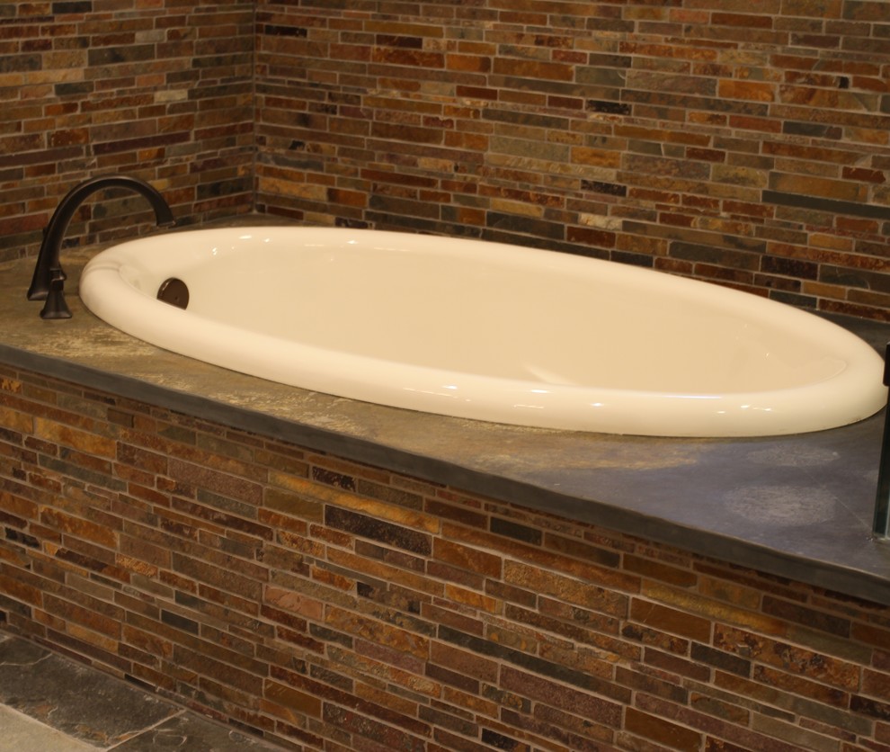 Example of a mid-sized classic master drop-in bathtub design in Houston