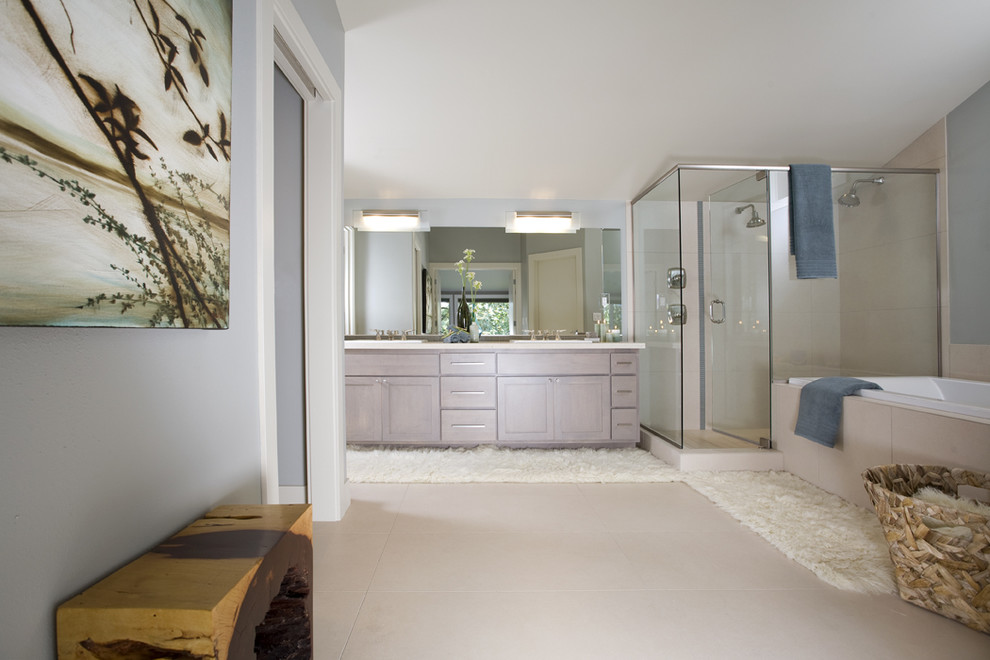 Bathroom - large modern master beige floor bathroom idea in Seattle with shaker cabinets, light wood cabinets, gray walls, quartzite countertops and a hinged shower door