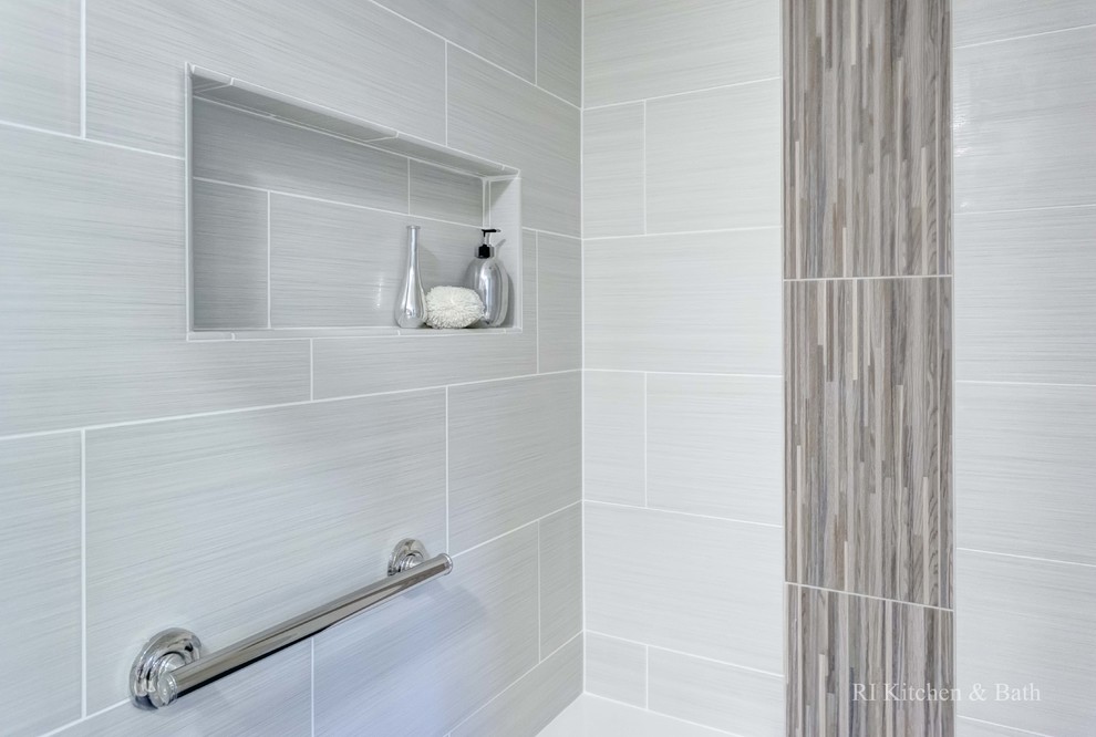 Inspiration for a large contemporary master beige tile and porcelain tile porcelain tile corner shower remodel in Providence with an undermount sink, shaker cabinets, dark wood cabinets, solid surface countertops, a one-piece toilet and gray walls