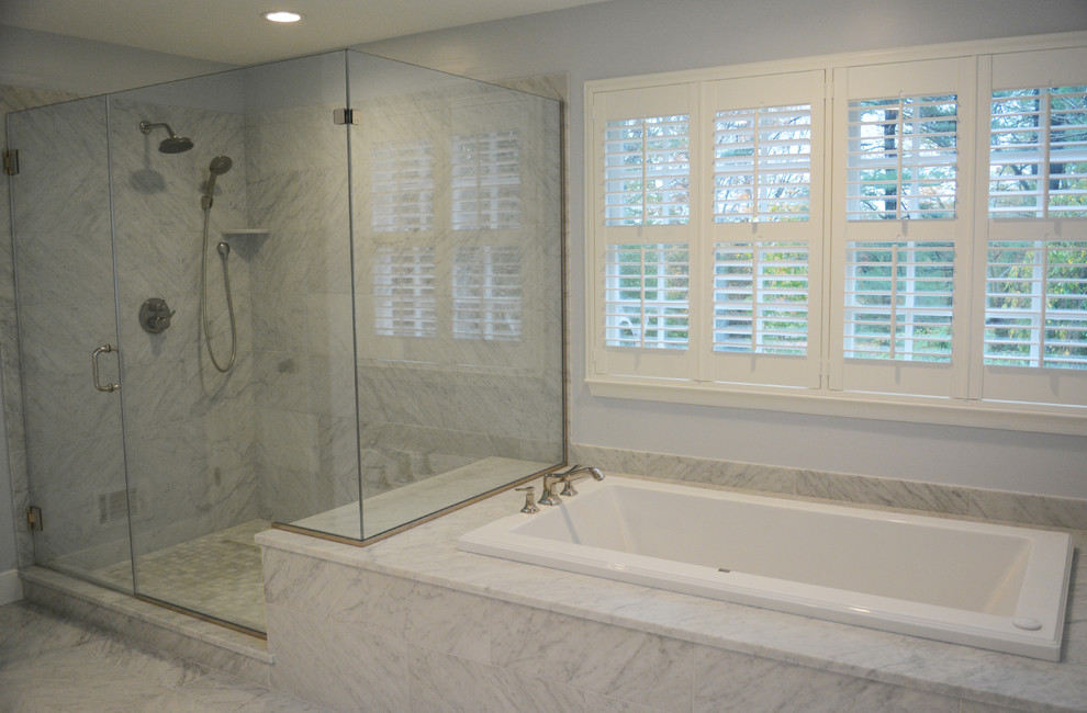 Large transitional master white tile and stone tile marble floor bathroom photo in Philadelphia with an undermount sink, flat-panel cabinets, white cabinets, marble countertops, a one-piece toilet and gray walls