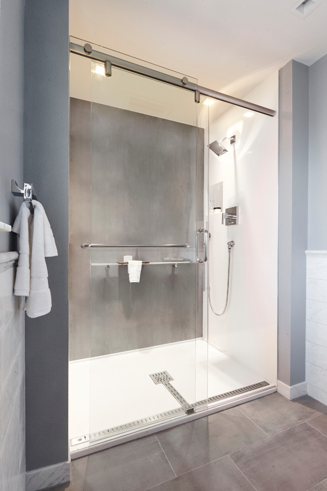 Small modern shower room bathroom in Dallas with flat-panel cabinets, black cabinets, a built-in shower, a two-piece toilet, grey tiles, stone slabs, grey walls, ceramic flooring, a submerged sink and granite worktops.